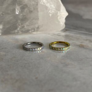 Aro clicker circonitas tornasol titanio