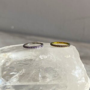 Aro clicker circonitas purpuras Titanio